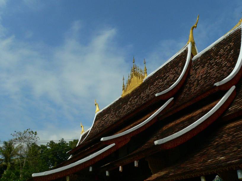 Detalhe do templo Wat Xieng Thong, também conhecido como Templo da Cidade Dourada Detalhe do templo Wat Xieng Thong, também conhecido como Templo da Cidade Dourada