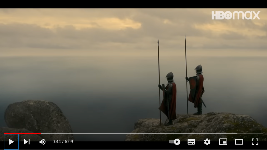 Reprodução de um trecho da série A Casa do Dragão que mostra dois personagens no topo da montanha com uma bela vista do vale